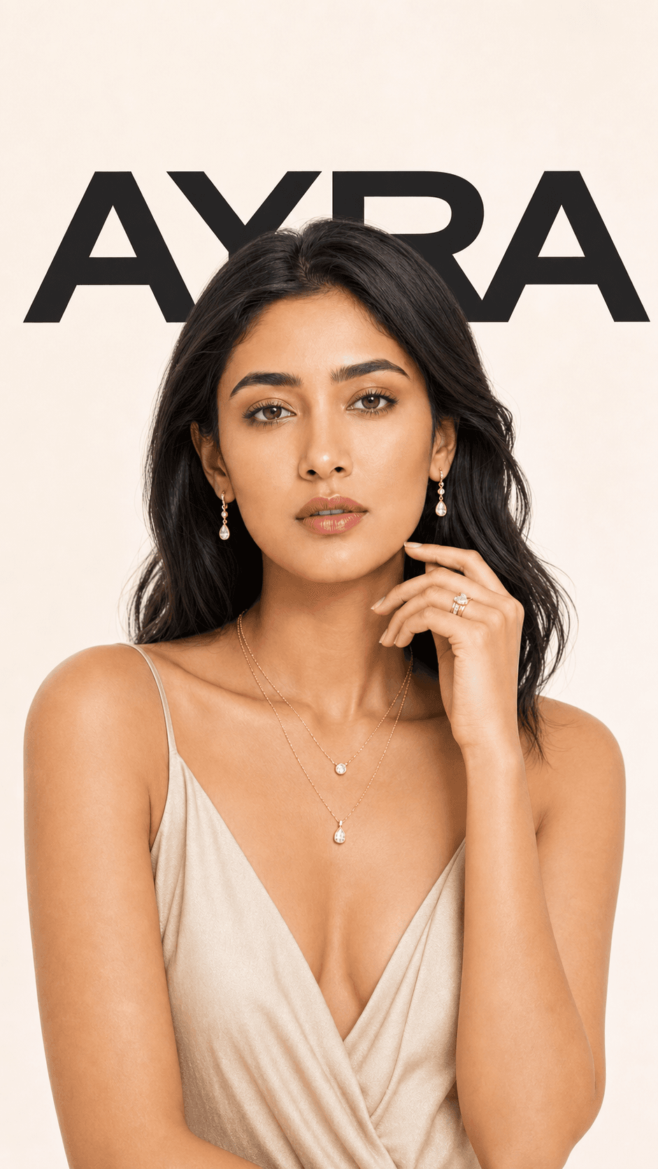 An Indian model wearing delicate gold and diamond jewellery against an AYRA backdrop